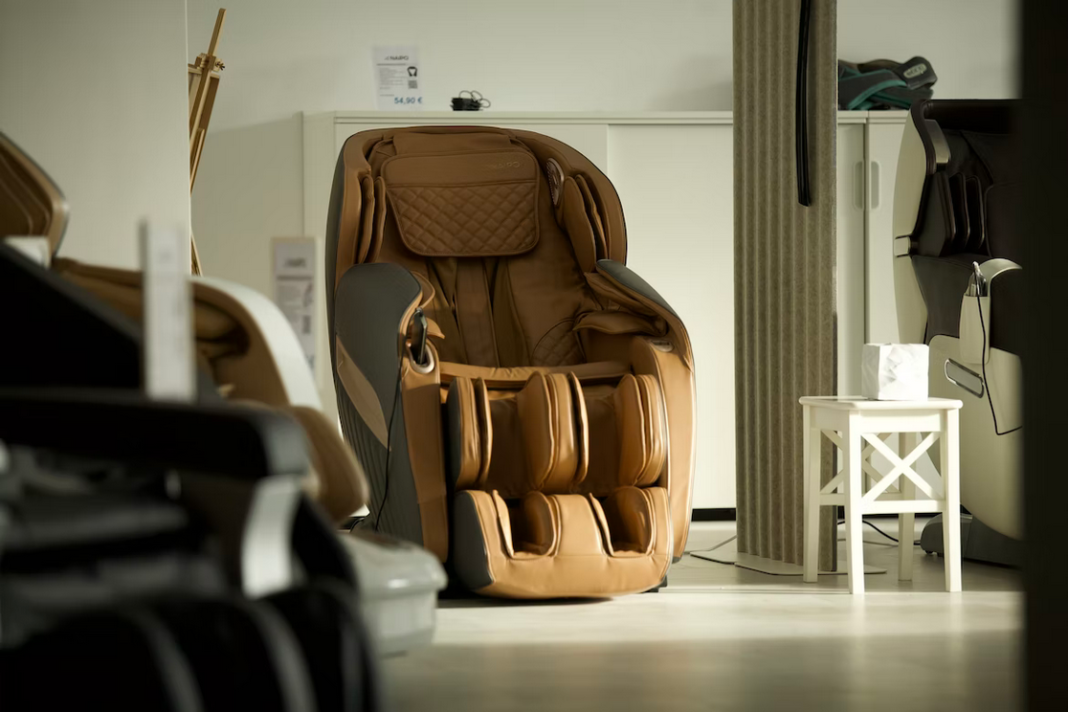 a brown deluxe massage chair in a showroom